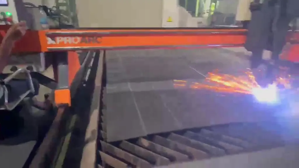 CNC plasma torch cutting a steel plate